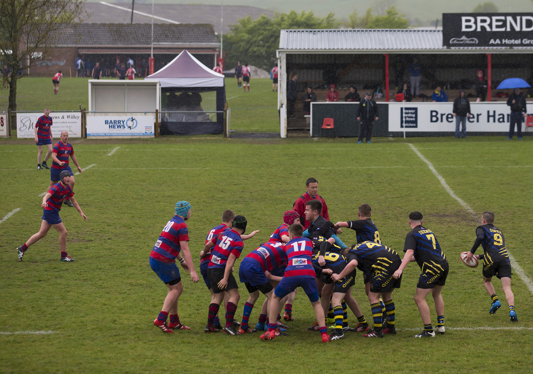 Rugby players competing on the pitch