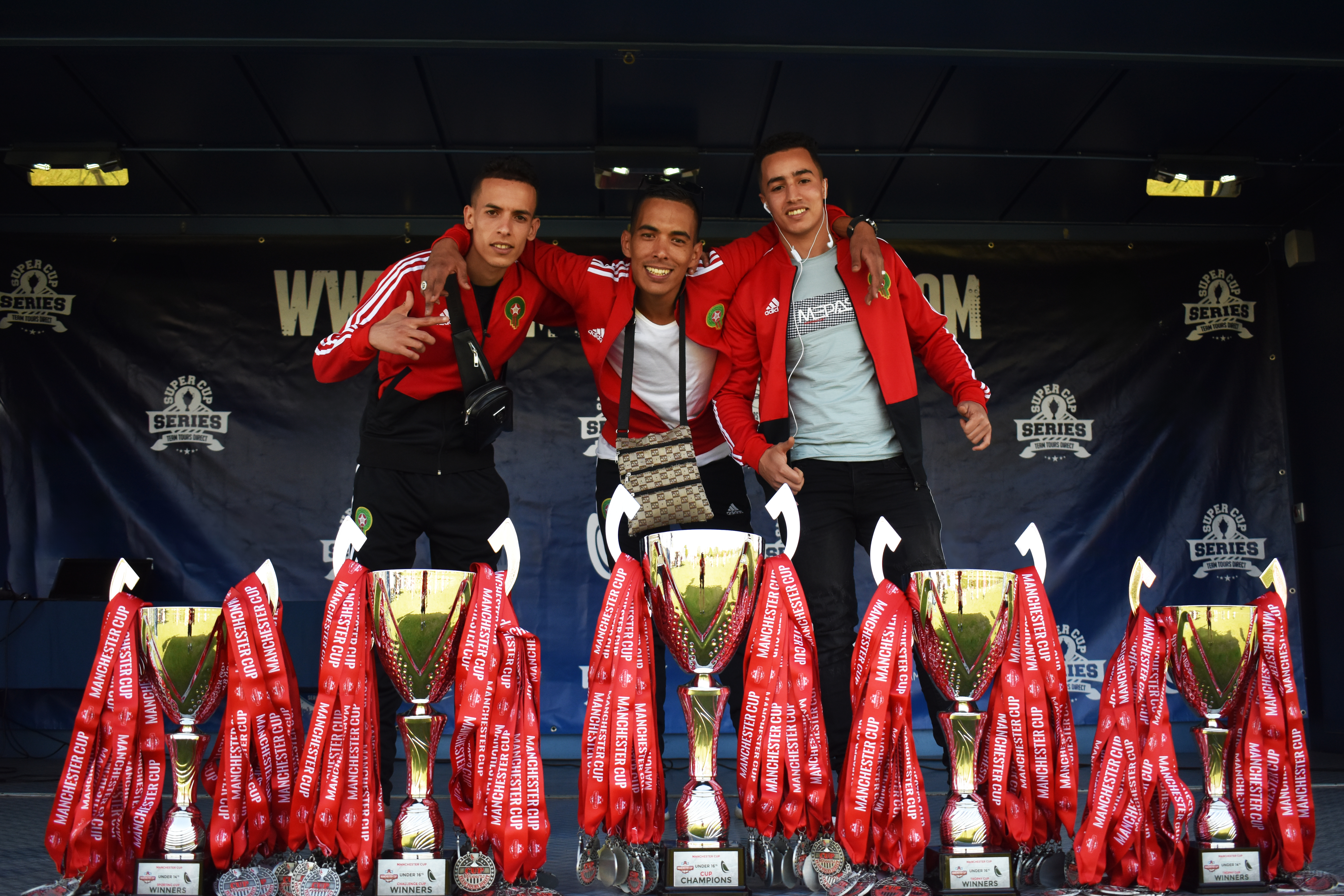 boys posing with victory smile at junior football tournament in manchester cup organised by tour international